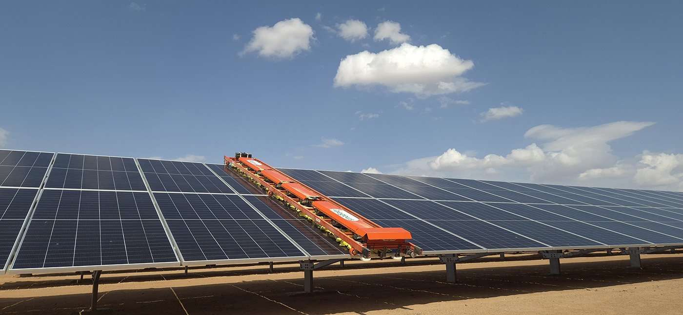 Aegeus Technologies Unicorn waterless solar cleaning robot on a solar farm