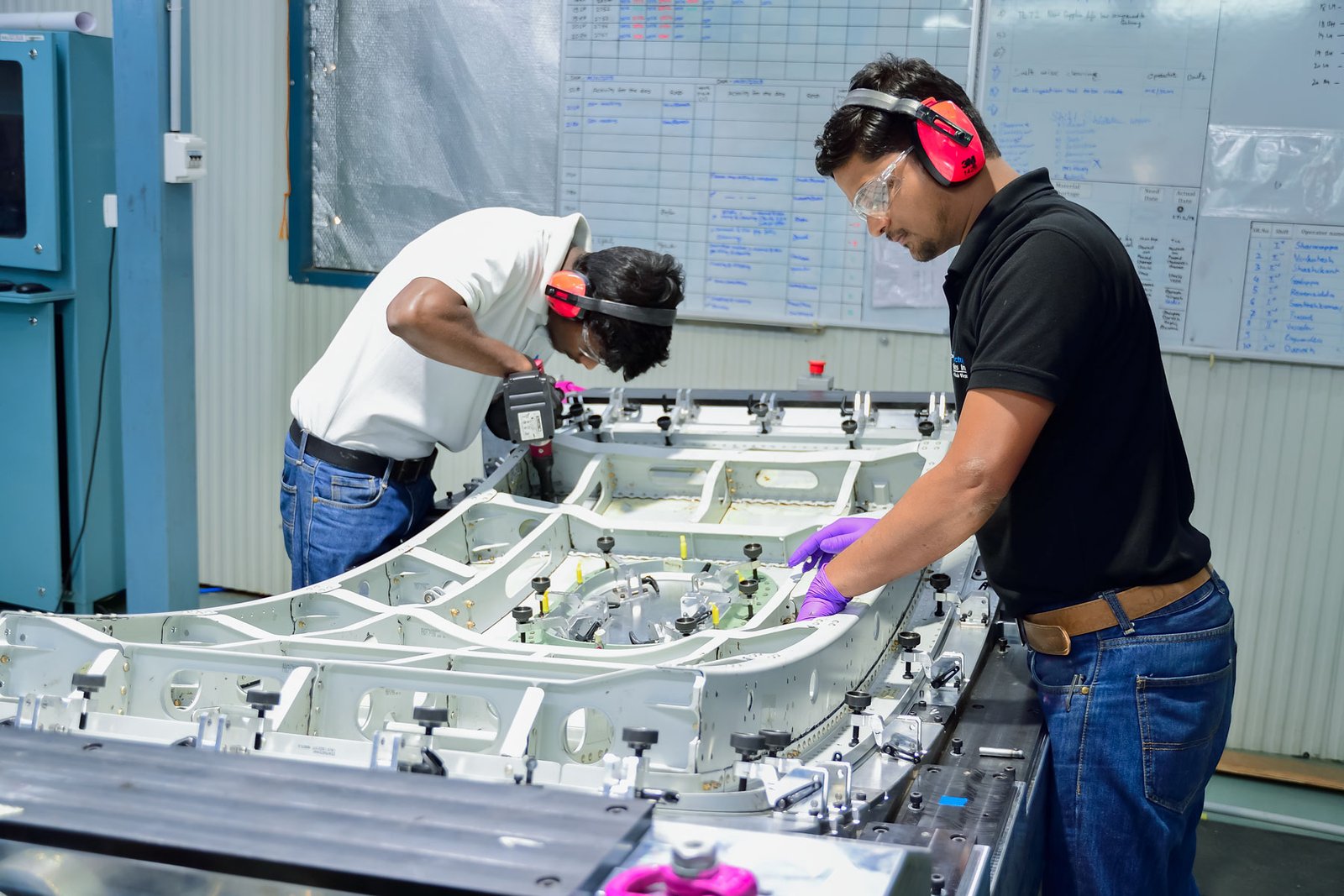 Engineers assembling an aerostructure at Aequs' Belagavi facility