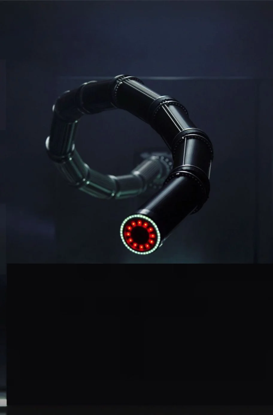 Armatrix snake-like robotic arm curled into a loop, close-up of the segmented hardware