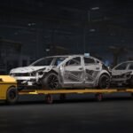 Ati Robotics Sherpa 10K towing car bodies through a factory