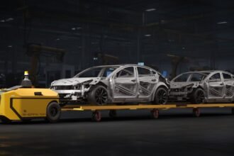 Ati Robotics Sherpa 10K towing car bodies through a factory