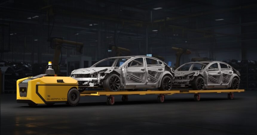 Ati Robotics Sherpa 10K towing car bodies through a factory