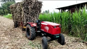 AutoNxt X45H2 electric tractor hauling a sugarcane trailer at Jaywant Sugar Mill