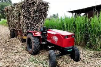 AutoNxt X45H2 electric tractor hauling a sugarcane trailer at Jaywant Sugar Mill