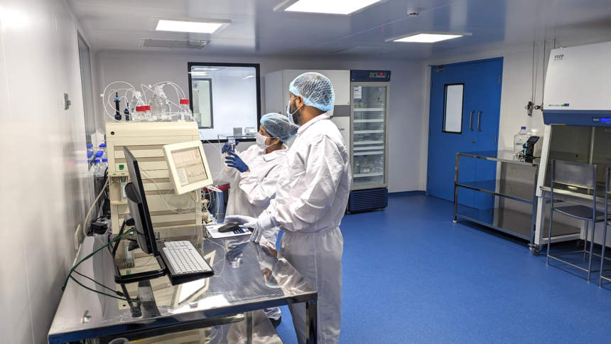 PopVax GMP cleanroom with scientists at work in Hyderabad