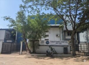 Thrustworks Dynetics facility exterior in Pune with the company signboard