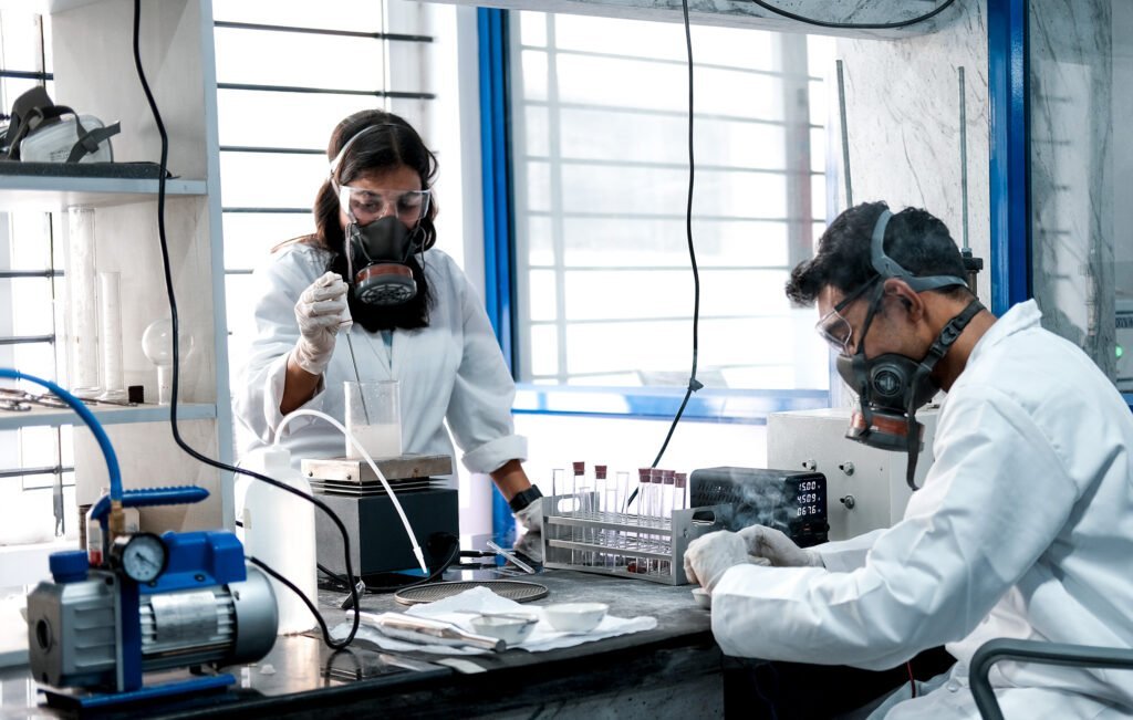 Alt text: SpaceFields engineers working in the propellant chemistry laboratory