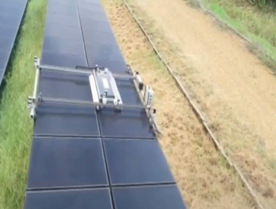 Alt text: Solavio Eco Bot cleaning solar panels with waterless microfiber technology