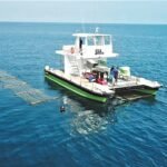 Sea6 Energy SeaCombine ocean tractor harvesting seaweed at sea