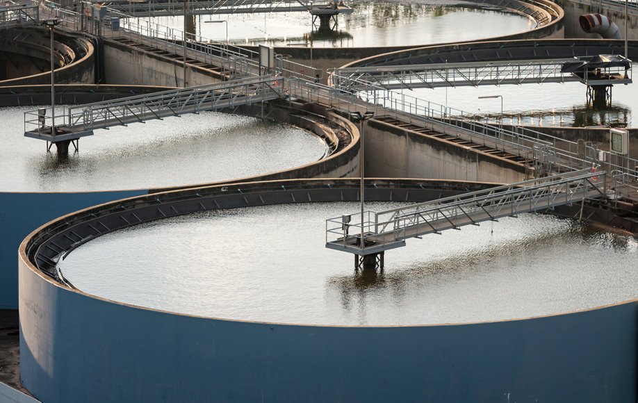 Alt text: Industrial wastewater effluent treatment tanks at a plant