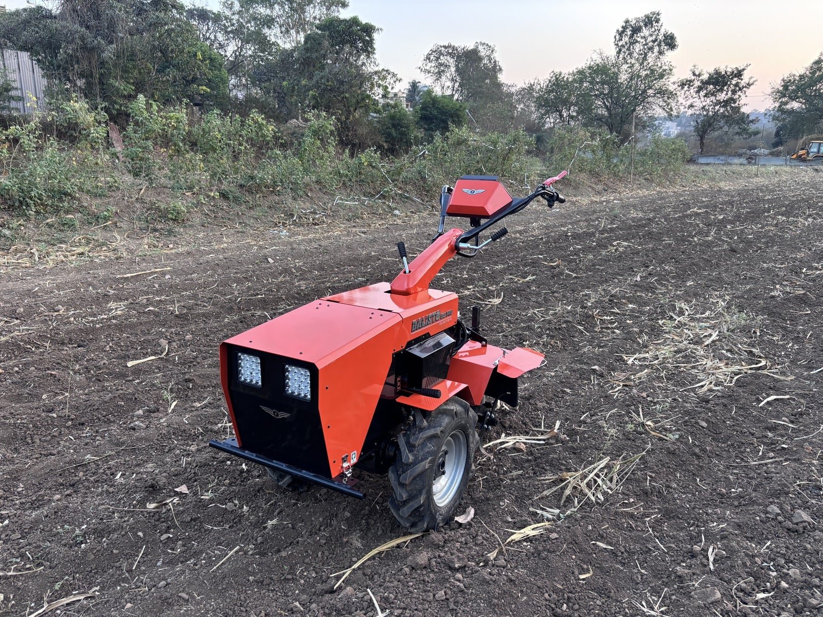 The Balisto 130 Pro electric farm machine working in a plowed field
