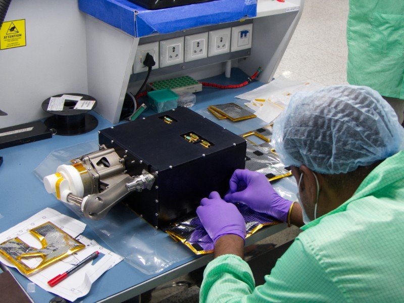 A Bellatrix Aerospace engineer assembling a propulsion system in the company's cleanroom