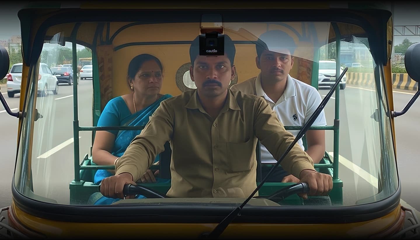 Cautio's AI dashcam mounted in an auto-rickshaw, watching the road and the driver
