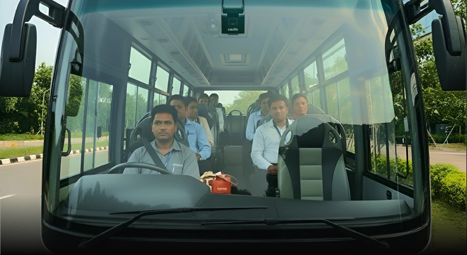 Cautio's AI dashcam mounted in a bus, watching the driver and passengers