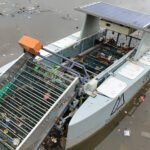 Clearbot Class 3 autonomous vessel collecting floating waste