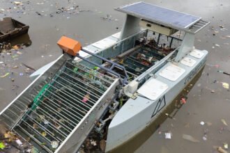 Clearbot Class 3 autonomous vessel collecting floating waste