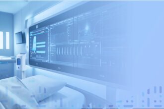 Hospital bed with Dozee contactless monitoring and live vitals dashboard