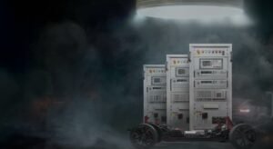 Exeliq high-voltage battery-test cabinets beside an electric-vehicle chassis