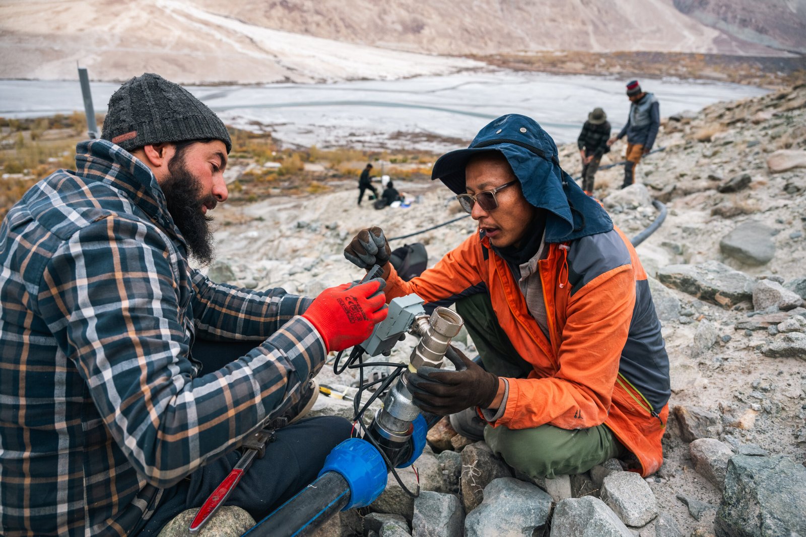 Acres of Ice team members assembling an Automated Ice Reservoir