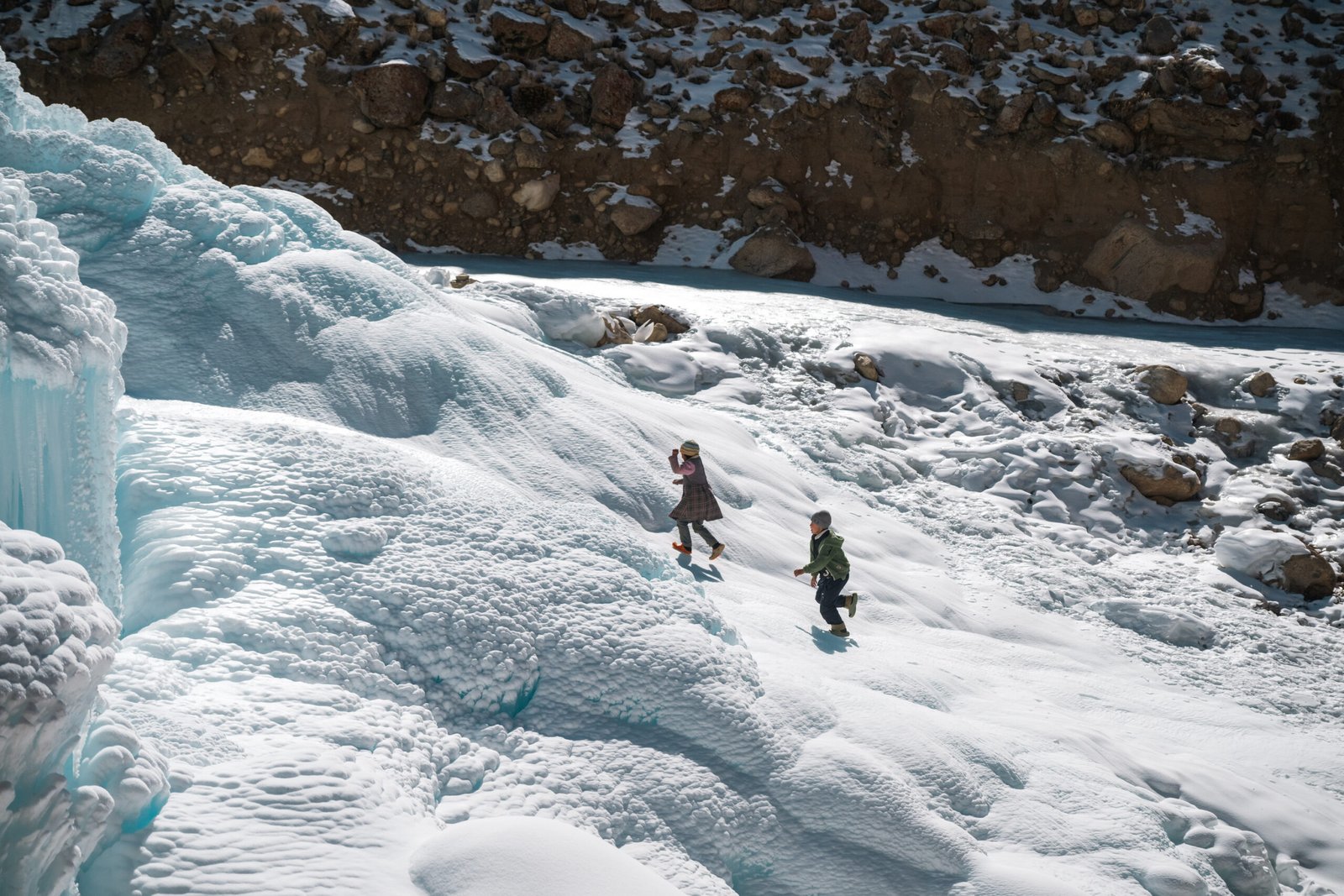 Children playing on an automated ice reservoir in Ladakh