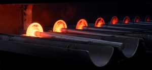 GNA Axles hot-forged rear axle shafts glowing in the forge