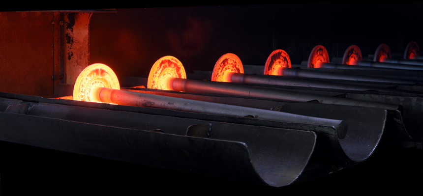 GNA Axles hot-forged rear axle shafts glowing in the forge
