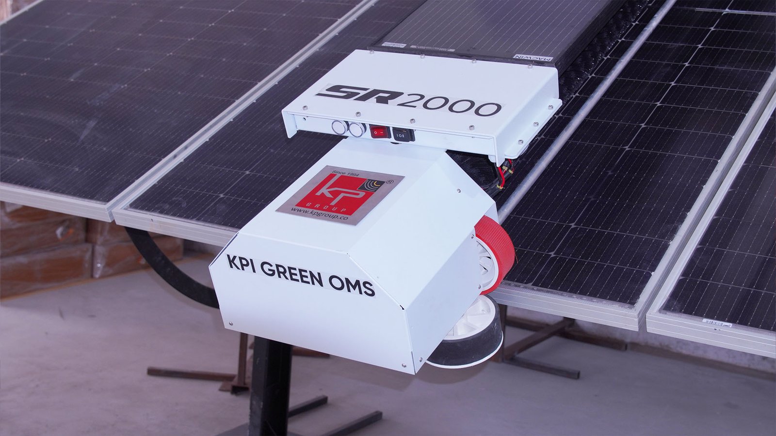 KPI Green OMS SR2000 waterless solar cleaning robot on a solar panel row