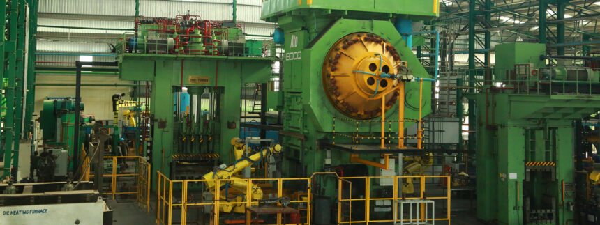 M M Forgings forge shop with large green forging presses