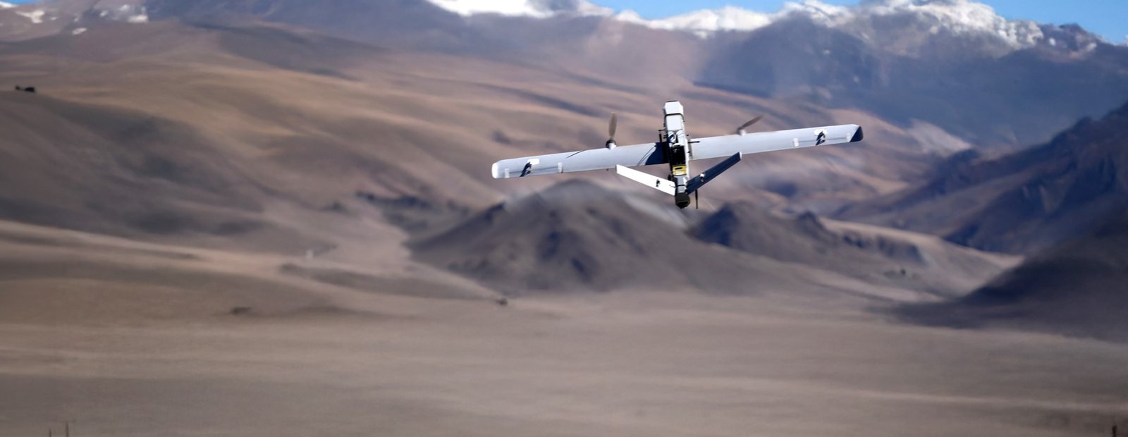 Nagastra fixed-wing loitering munition over mountainous terrain
