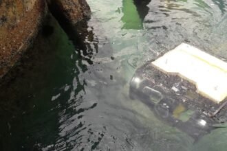 A Planys underwater robot at work beside a submerged structure