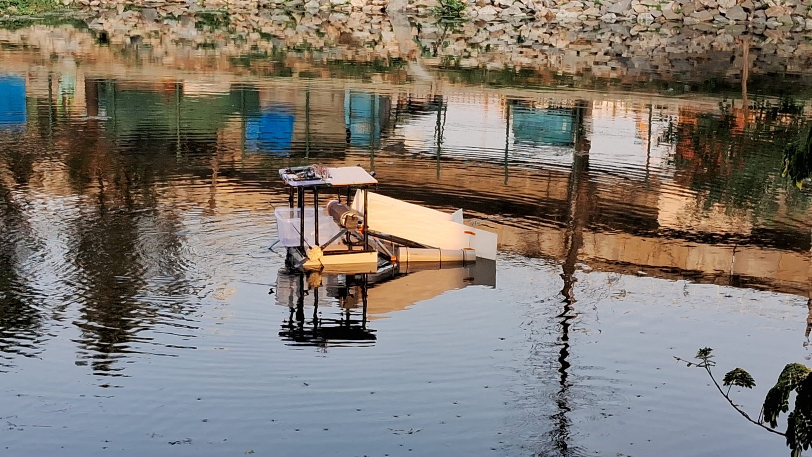 SCRUB V1 twin-hull lake-cleaning robot on the water