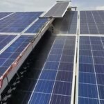 SudoYantra's waterless solar panel cleaning robot at work on a live solar farm