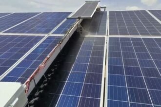 SudoYantra's waterless solar panel cleaning robot at work on a live solar farm
