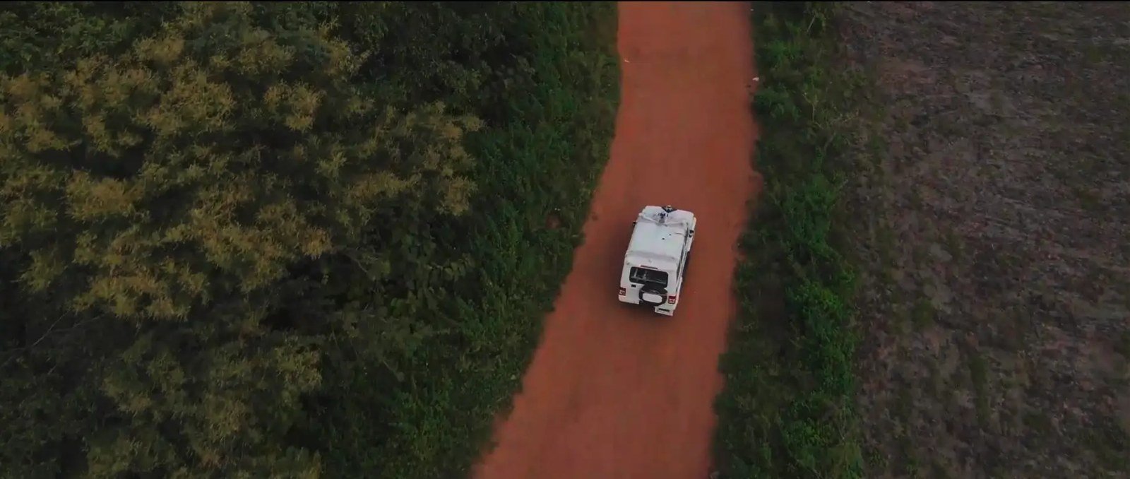 A Swaayatt test vehicle driving itself along a rural road, seen from above