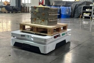 Tensrai autonomous mobile robot carrying a pallet in a warehouse