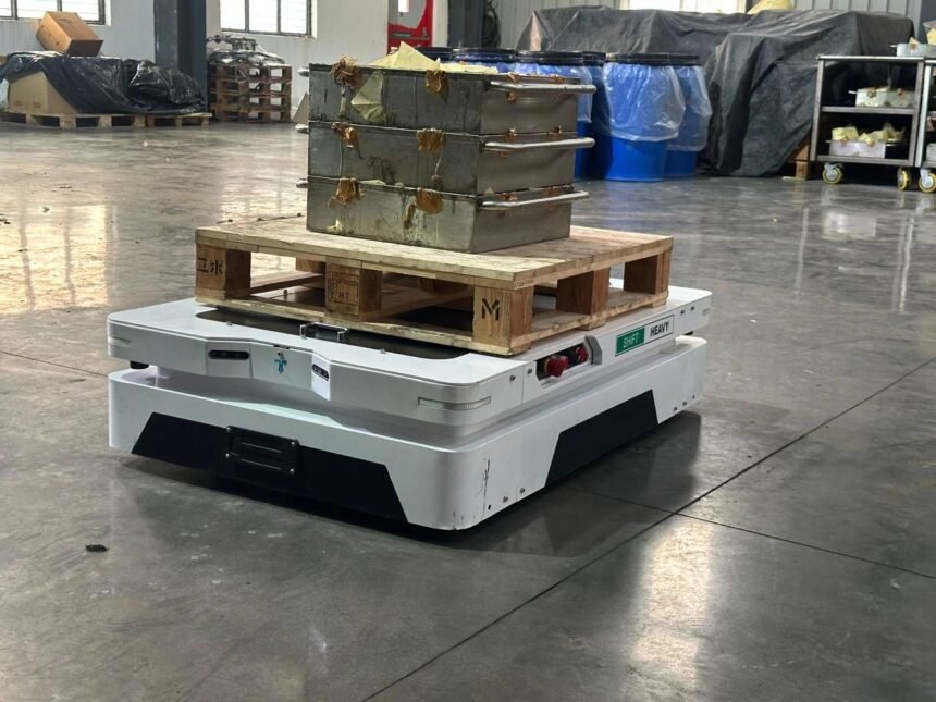 Tensrai autonomous mobile robot carrying a pallet in a warehouse