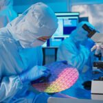 Tessolve Semiconductor engineer inspecting a silicon wafer