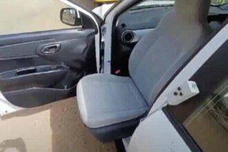 TurnPlus electric swivel seat rotated 90 degrees outward from a car door - official product photo from TRUE Assistive Technology