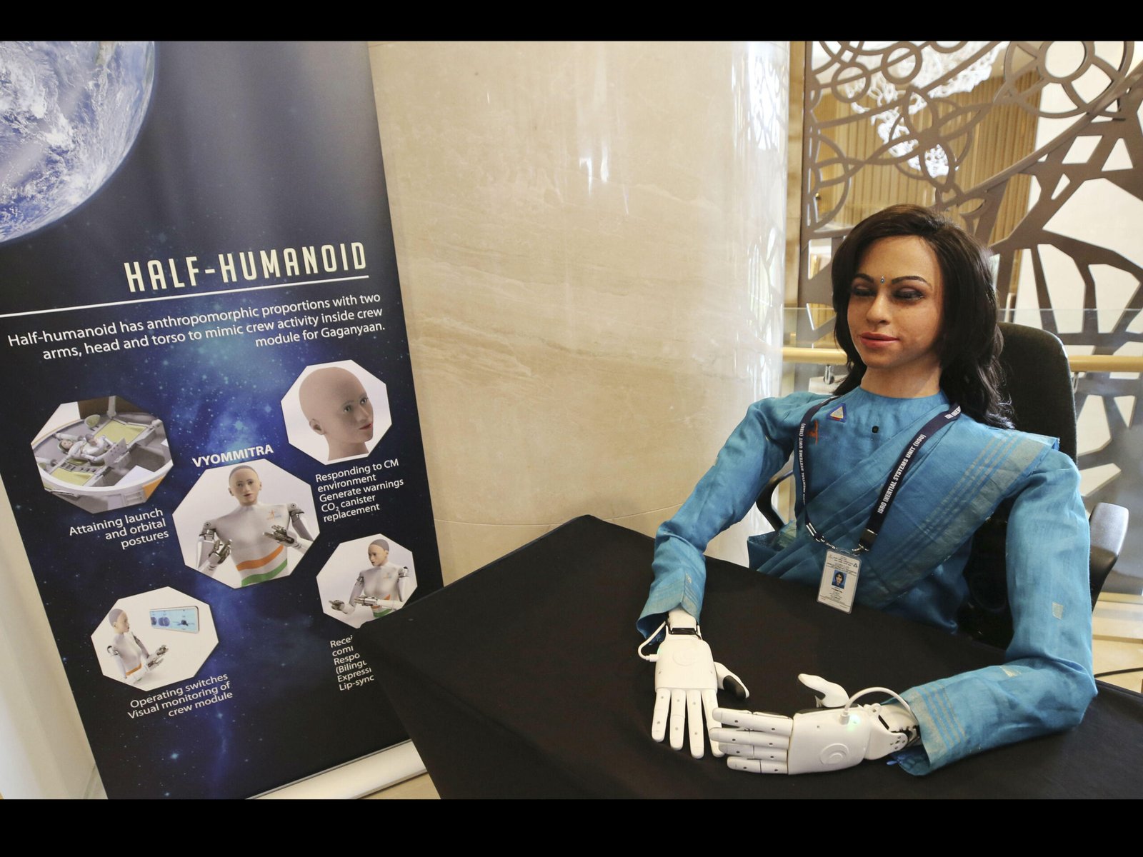 Vyommitra beside an ISRO display explaining the half-humanoid