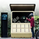 Two Zeno Emara electric motorcycles at a Zeno battery-swap station